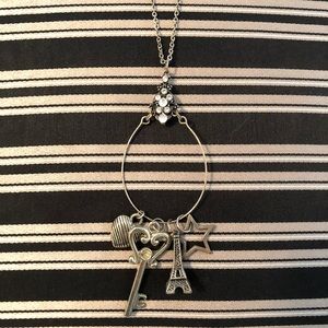 Long multiple pendant necklace.